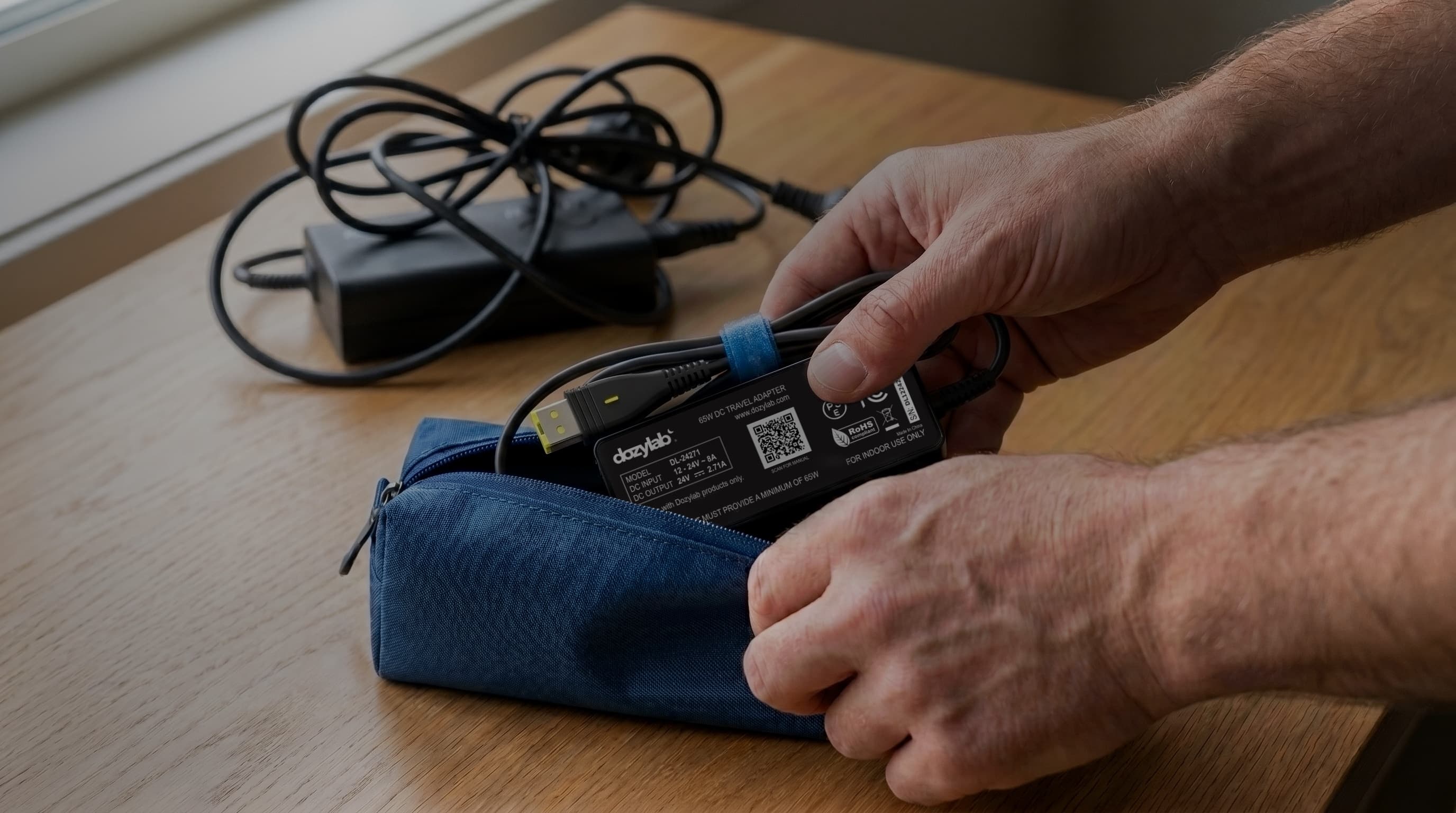 Packing the slim Dozylab USB-C cable into a travel organiser, leaving the bulky CPAP power adapter behind